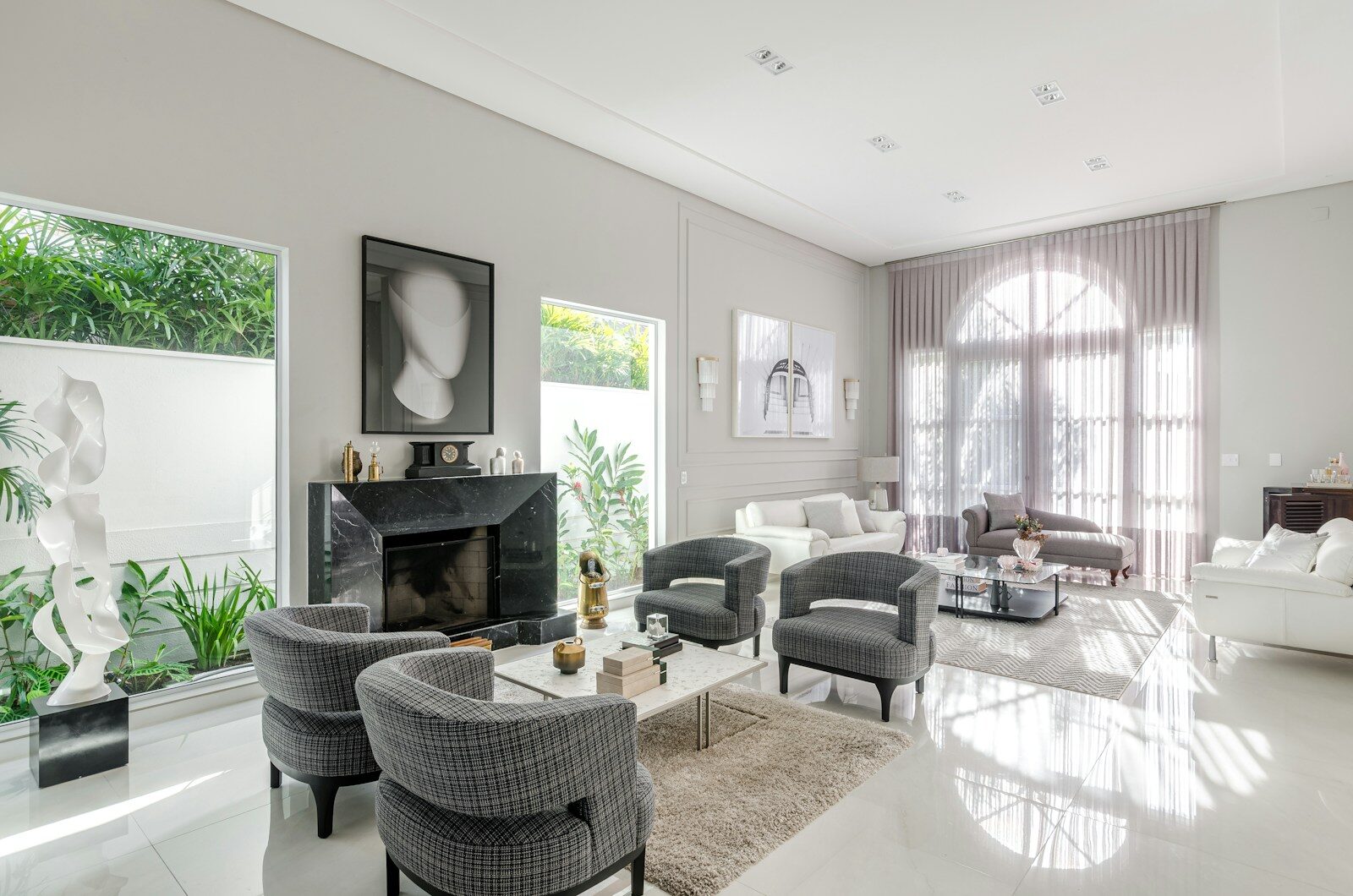 A living room filled with furniture and a fire place